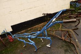 A Garretts Patent, Suffolk-at-Hone, Kent, iron framed horse drawn cultivator with blue and red