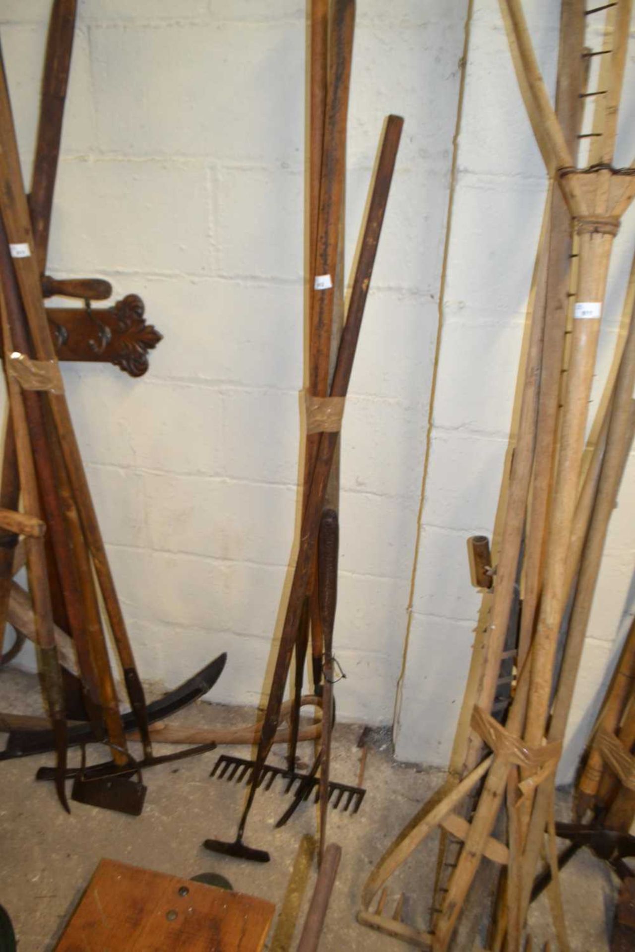 Bundle of various tools to include large silage knife, rake etc