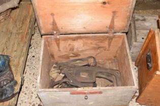 Wooden box containing various horse leathers