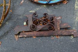 A set of three cast iron brackets with scroll work decoration, 95cm long