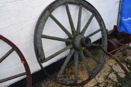 A wood framed and iron mounted cartwheel, significantly degraded condition