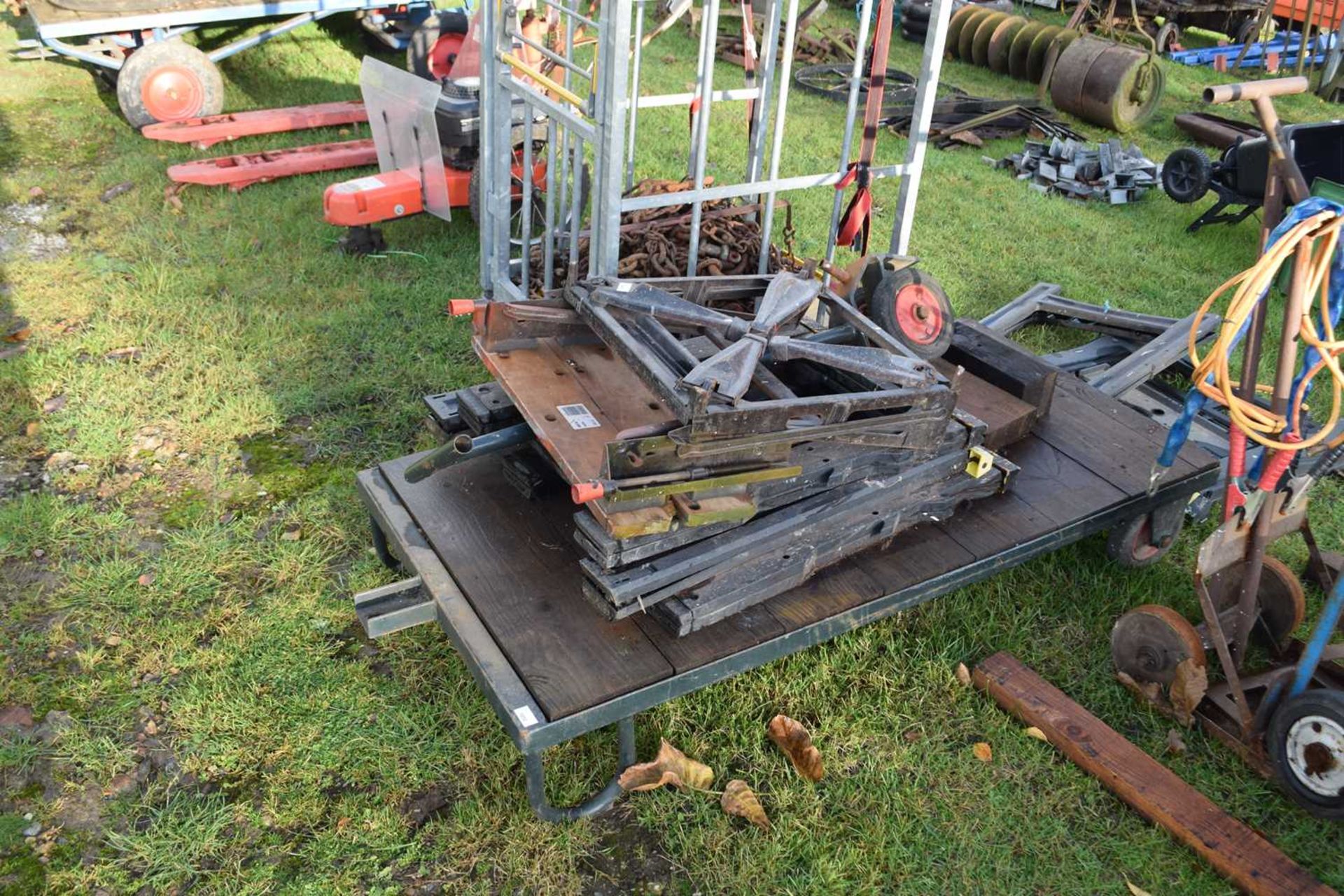 An iron framed and wood trolley - NOTE: Does not include the items on the trolley