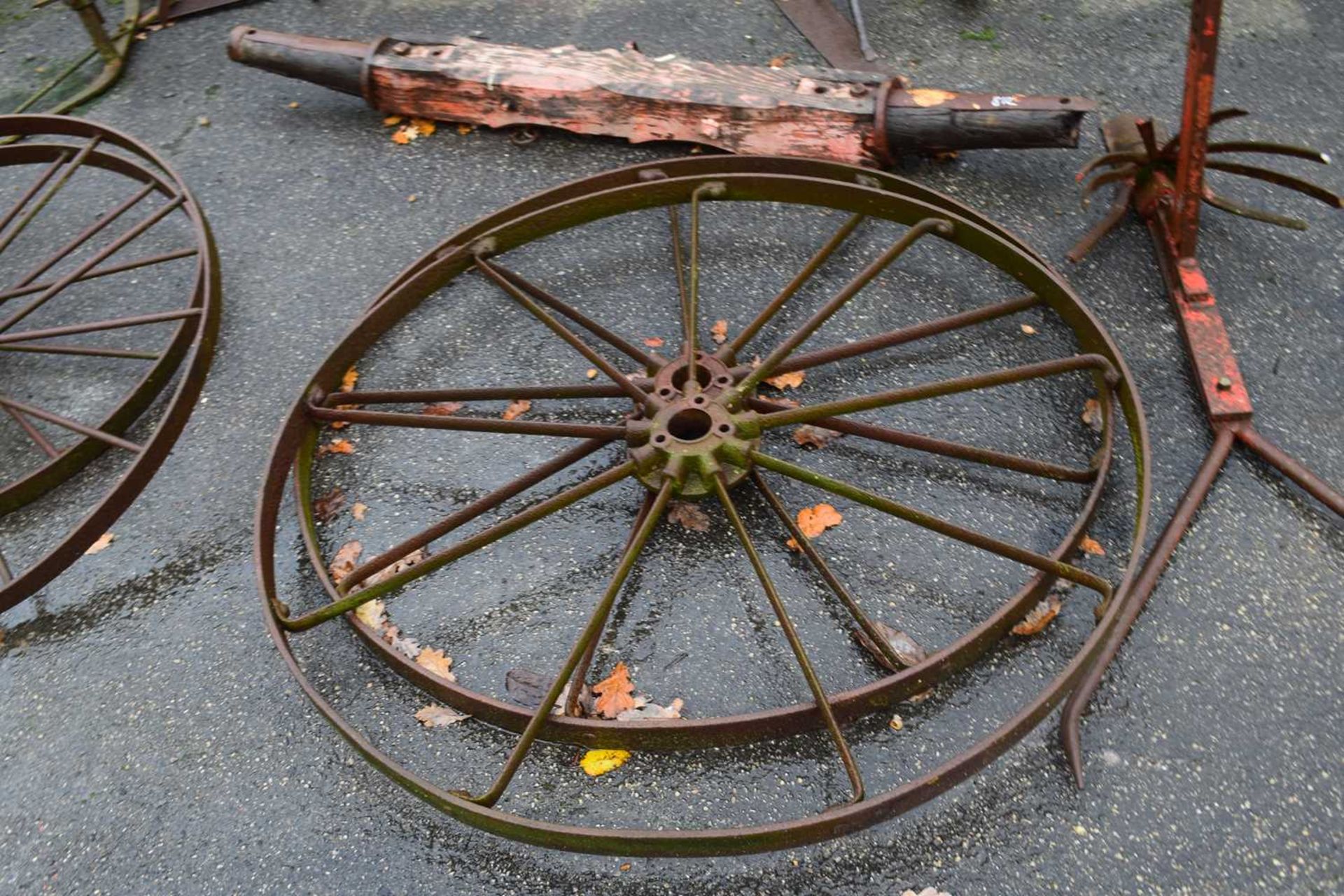 A pair of large iron wheels, 132cm diameter