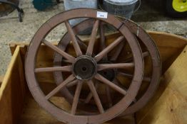 Pair of small wood and iron mounted wheels