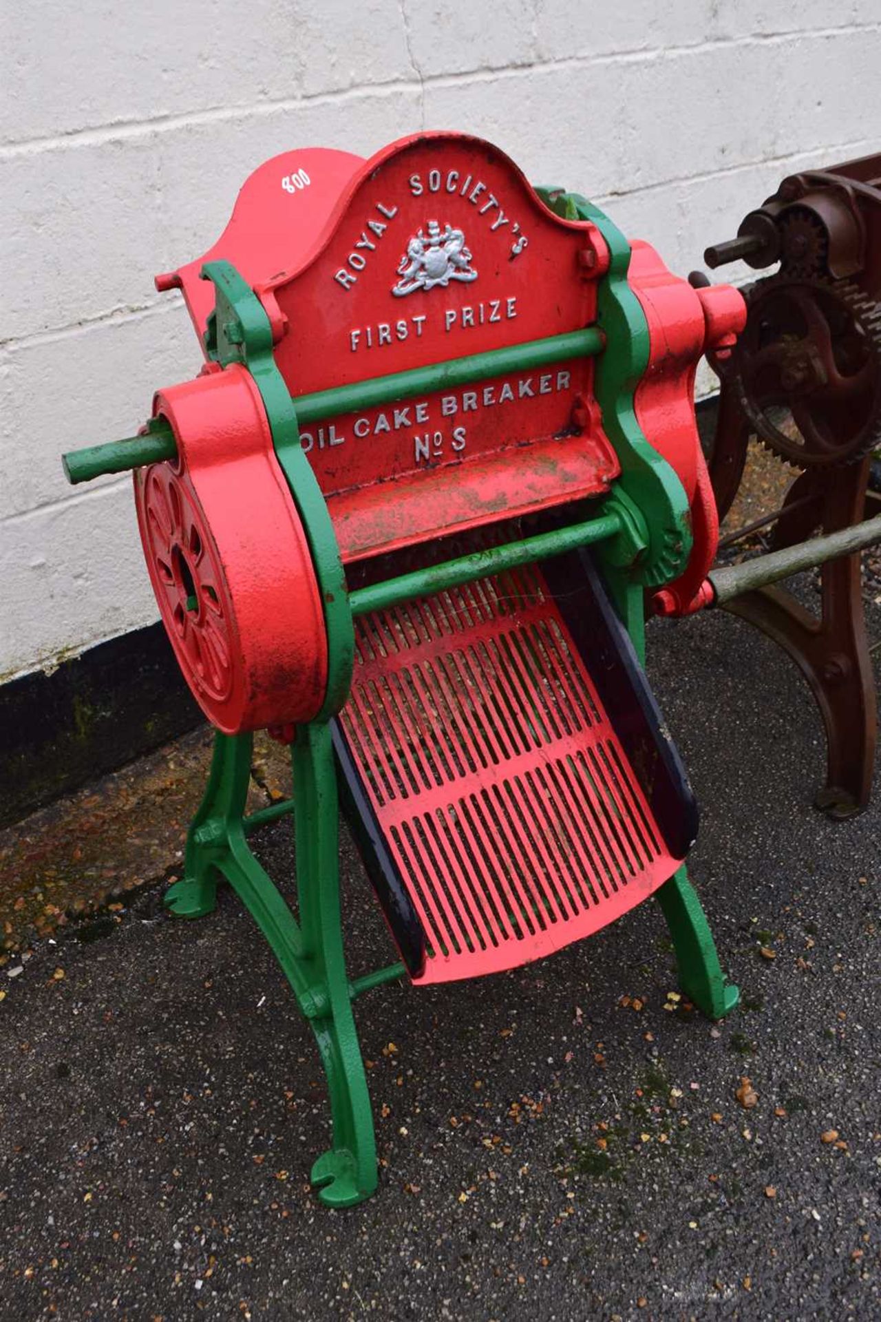 An oil cake breaker, NOS Royal Society's First Prize model painted in red and green