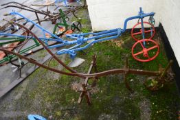 An iron framed horse drawn cultivator, for restoration