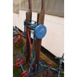 W Rainforth & Sons, Lincoln, a wood and iron framed sack lifting barrow with blue and red painted