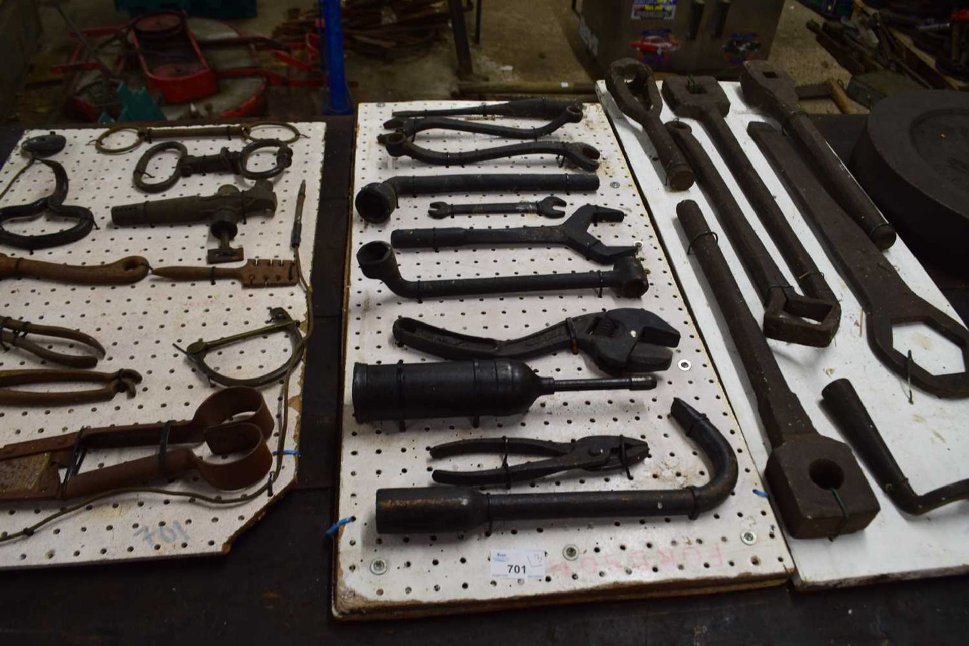 Three display boards, various pliers, spanners, sockets and other implements