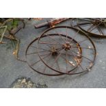 A pair of large iron wheels, 109cm diameter
