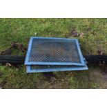 Two blue painted iron grills, possibly radiator grills together with a wooden and iron mounted