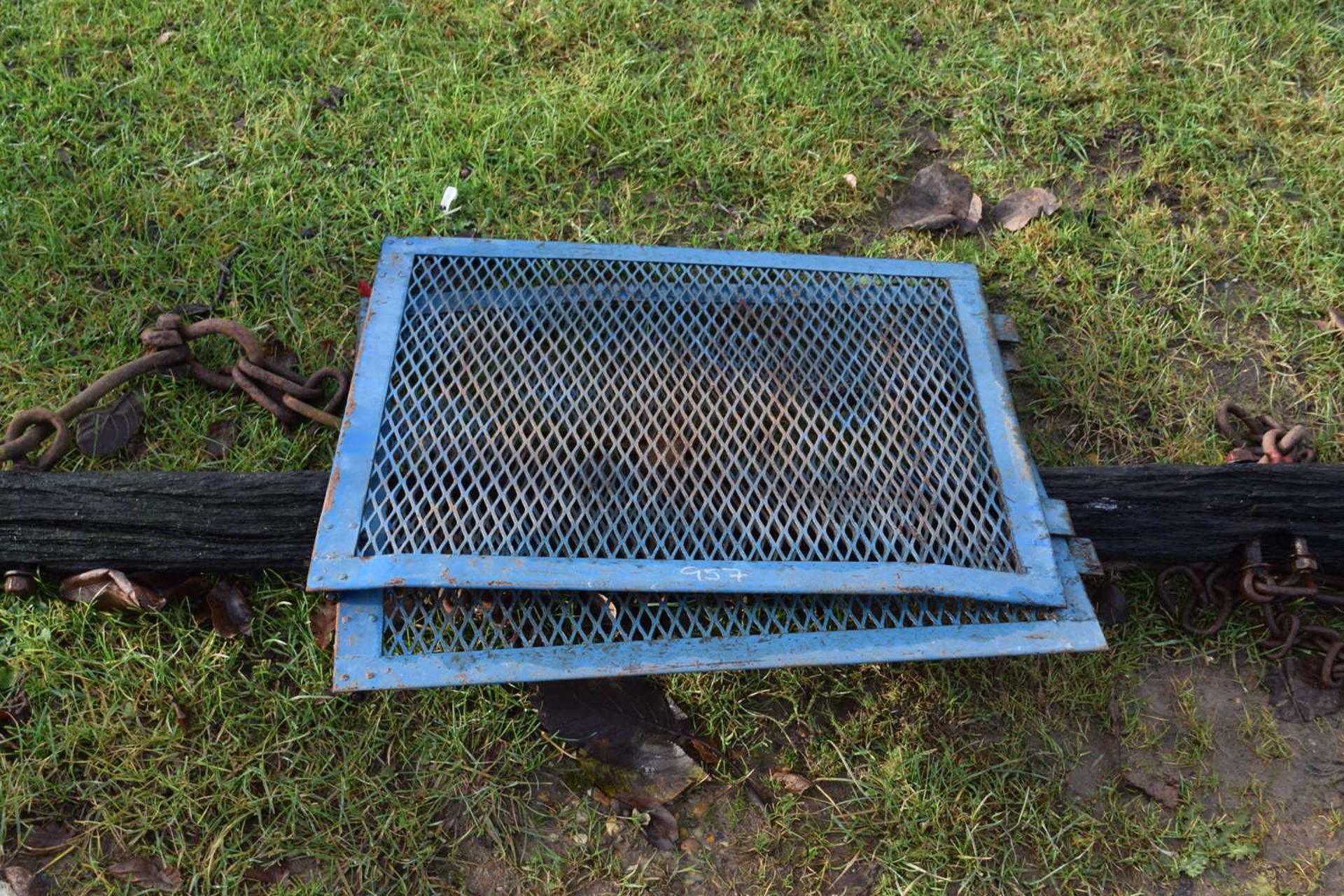 Two blue painted iron grills, possibly radiator grills together with a wooden and iron mounted