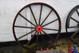 A wood framed and iron mounted cartwheel