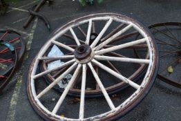 A pair of large wood framed iron and rubber mounted cartwheels, approx 150cm diameter