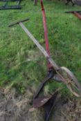 A single furrow hand plough together with a further small plough or cultivator marked AM.F & H Co,