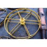 A pair of Huxtables Patent iron wheels, yellow painted, 117cm diameter
