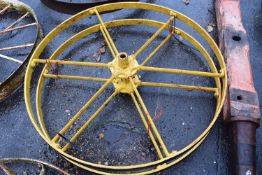 A pair of Huxtables Patent iron wheels, yellow painted, 117cm diameter