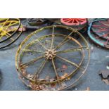 A pair of Bamfords Utoexter iron wheels, approx 132cm diameter