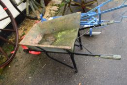 An iron framed and wood mounted vintage wheelbarrow
