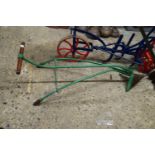 Small green painted iron plough