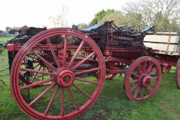 A 19th Century red painted twin axle farm wagon for restoration