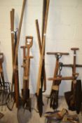 Bundle of implements to include silage knife, shepherds leg crook etc