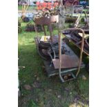 An iron framed twin axle hand trolley - NOTE: Does not include the items standing on the trolley