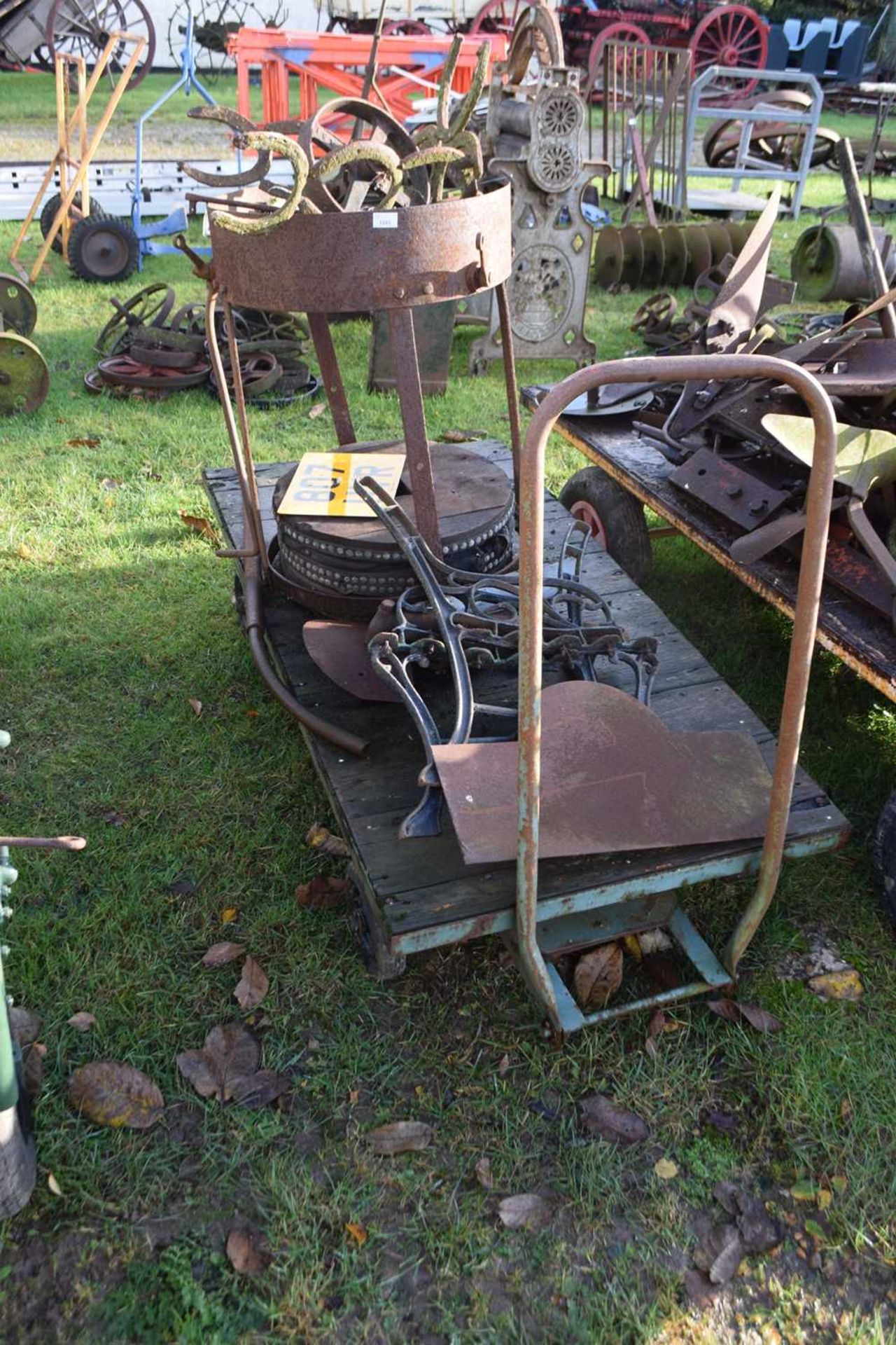 An iron framed twin axle hand trolley - NOTE: Does not include the items standing on the trolley