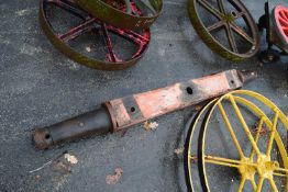 A wooden cart axle