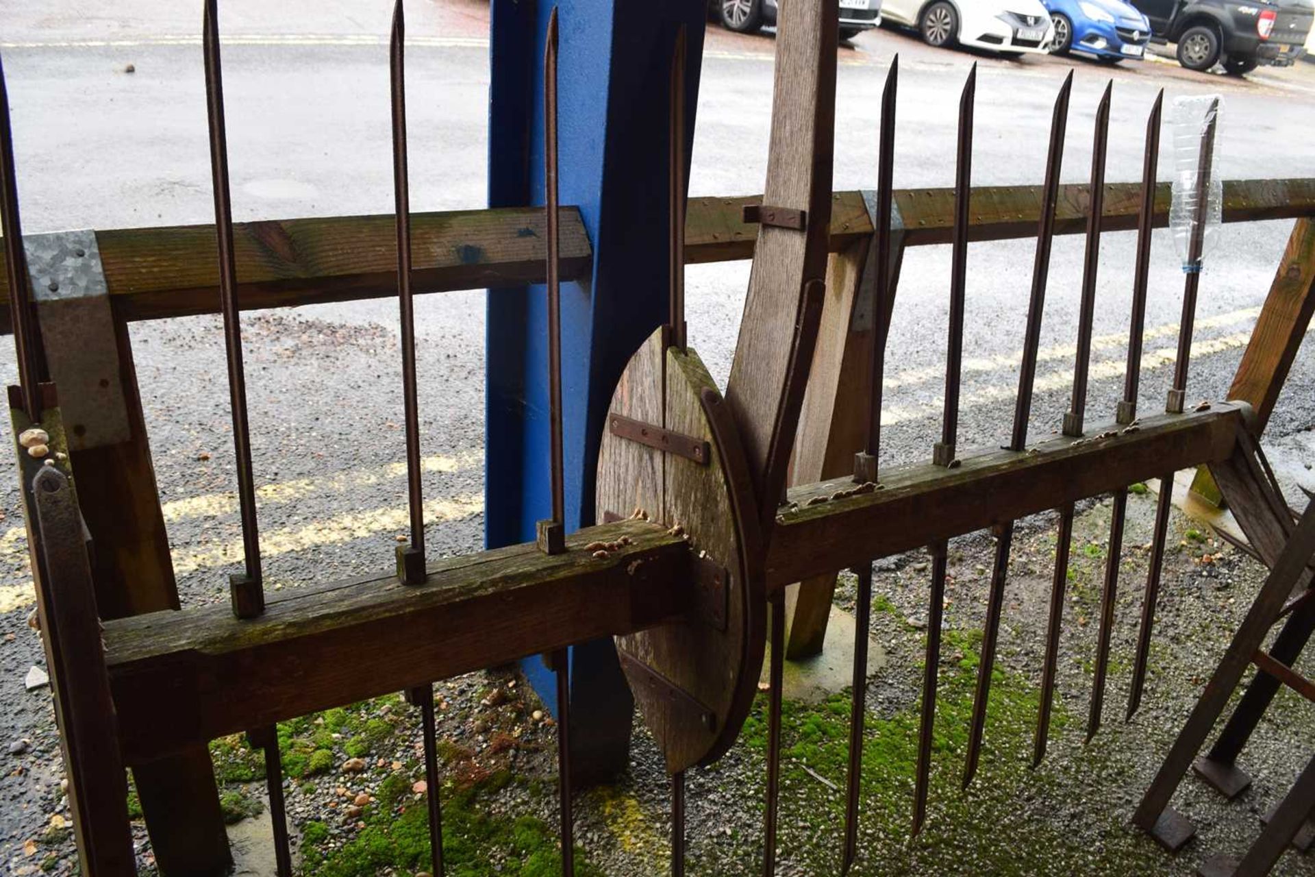 Two-piece wooden framed and iron hay rake bearing label 'Larkman & Sons, Besthorpe, Attleborough'