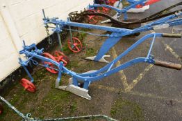 A horse drawn iron framed plough marked Ransomes, Sims & Jeffries Ltd, Ipswich