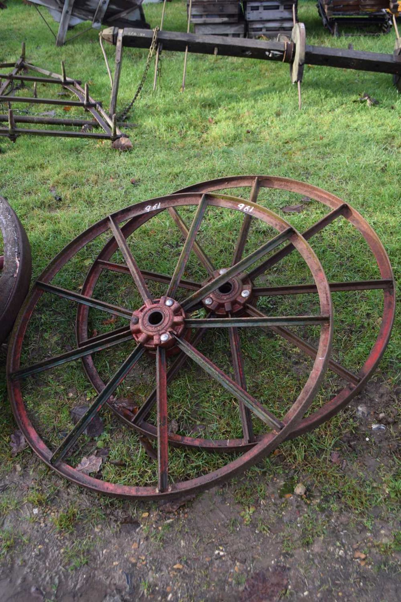 A pair of Nicholsons of Newark iron framed cart wheels, 45 inch diameter