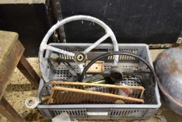 Box of mixed items to include steering wheels, radiator grilles etc