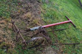 An iron framed push cultivator together with a wooden handled cultivator