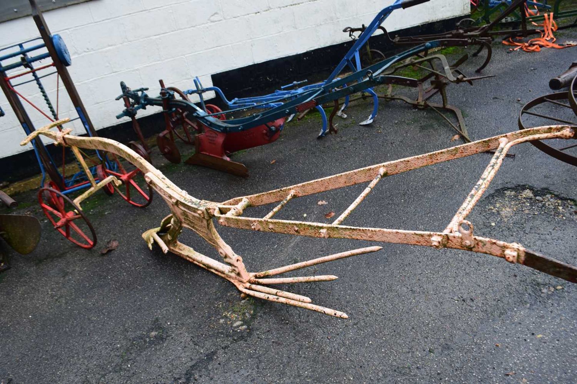 Ransomes & Jeffries, Ipswich, England, an iron framed RSR horse drawn plough, painted in cream