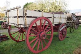 A twin axle farm wagon painted in red and cream for restoration together with a range of further