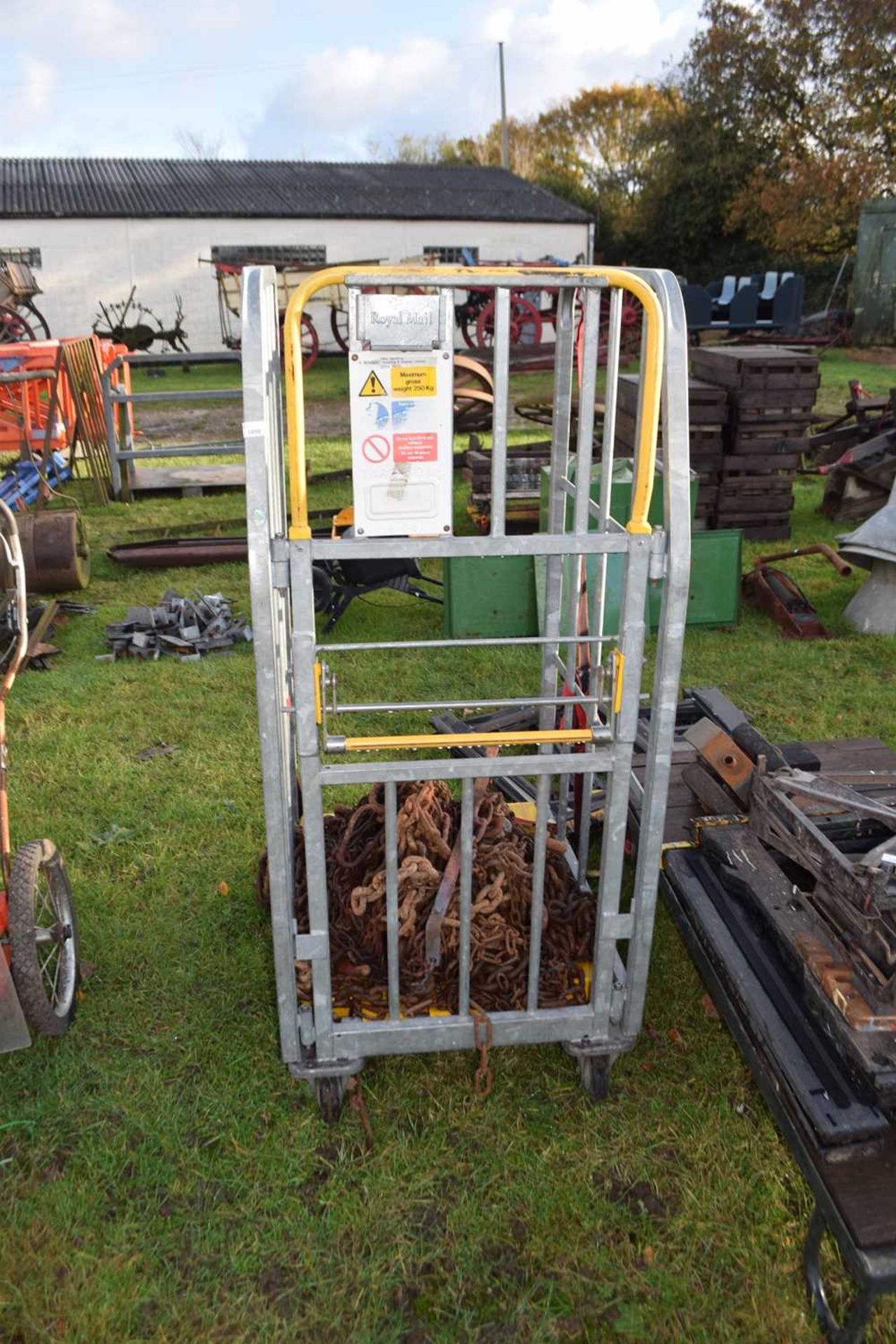 A Royal Mail stillage crate together with a quantity of various iron chain