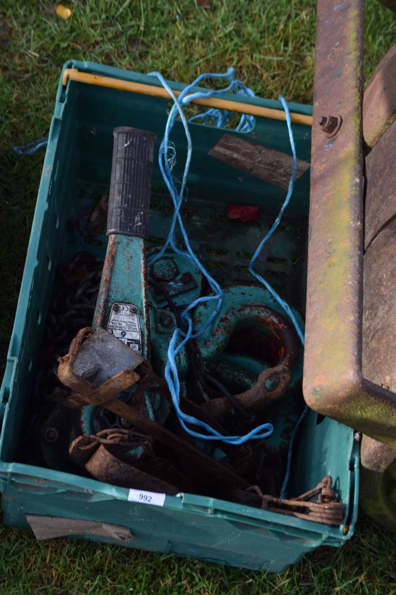 A box of lever hoist chains, traps and other items