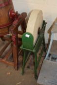 Grinding wheel in green painted iron frame