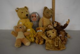 A collection of vintage soft toys to include a range of teddies, monkeys etc