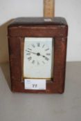 French brass cased carriage clock with outer leather mounted travel case