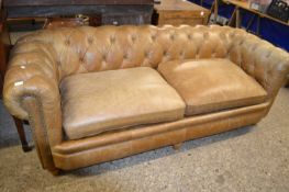 A leather Chesterfield style sofa