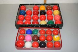 Two boxes of snooker balls