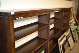 A large open front hardwood bookcase cabinet with adjustable shelves