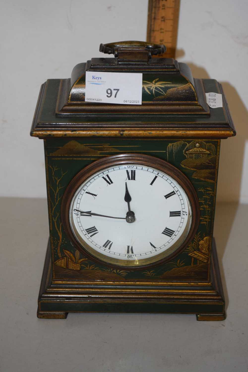 Early 20th Century mantel clock in a green japaned finish case