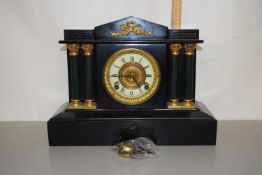 A Victorian mantel clock in architectural case