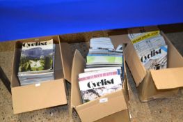Three boxes of The Cyclist magazines