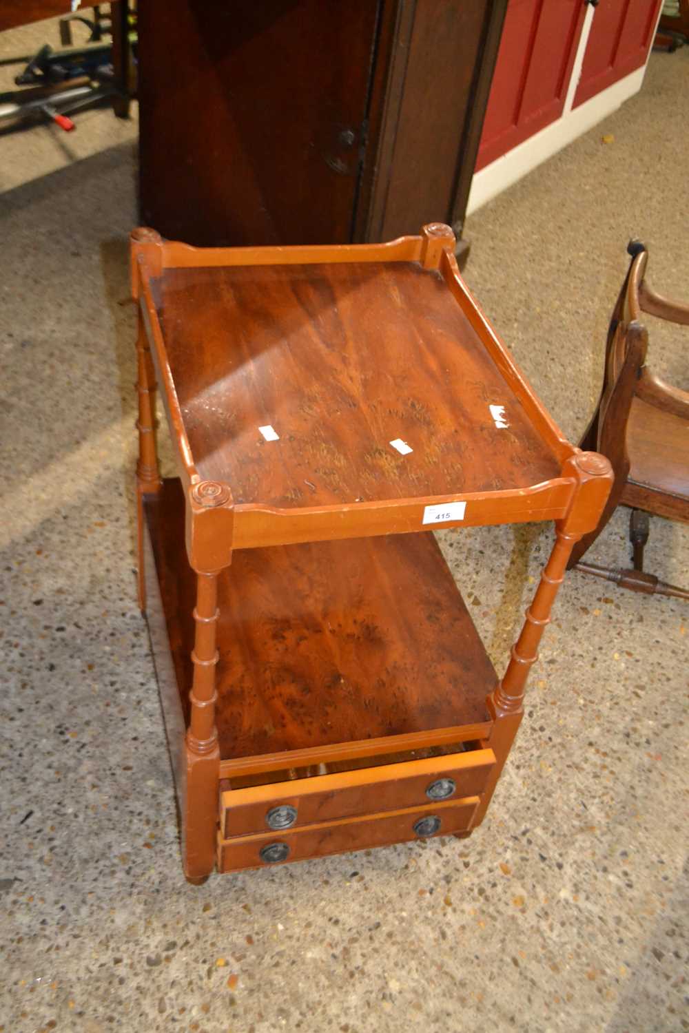 A yew wood veneered lamp table