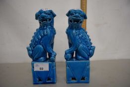 A pair of turquoise glazed foo dogs