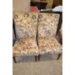 Pair of mid-century low armchairs with floral upholstery