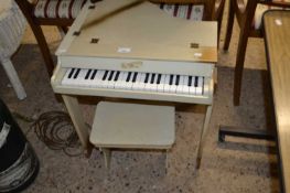 Child's miniature piano and stool
